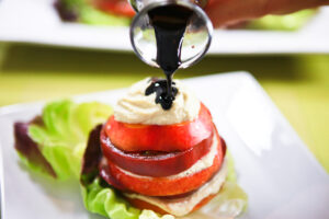 Nectarine Tomato Salad with Roasted Garlic Cashew Ricotta and Honey Balsamic Syrup