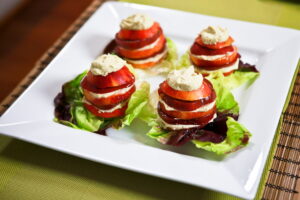 Nectarine Tomato Salad with Roasted Garlic Cashew Ricotta and Honey Balsamic Syrup