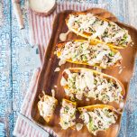White Bean and Brussels Sprouts Stuffed Delicata Squash with Lemon Tahini Sauce