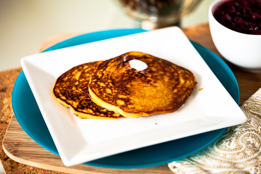 Persimmon Cornmeal Pancakes with Maple Cranberry Sauce 