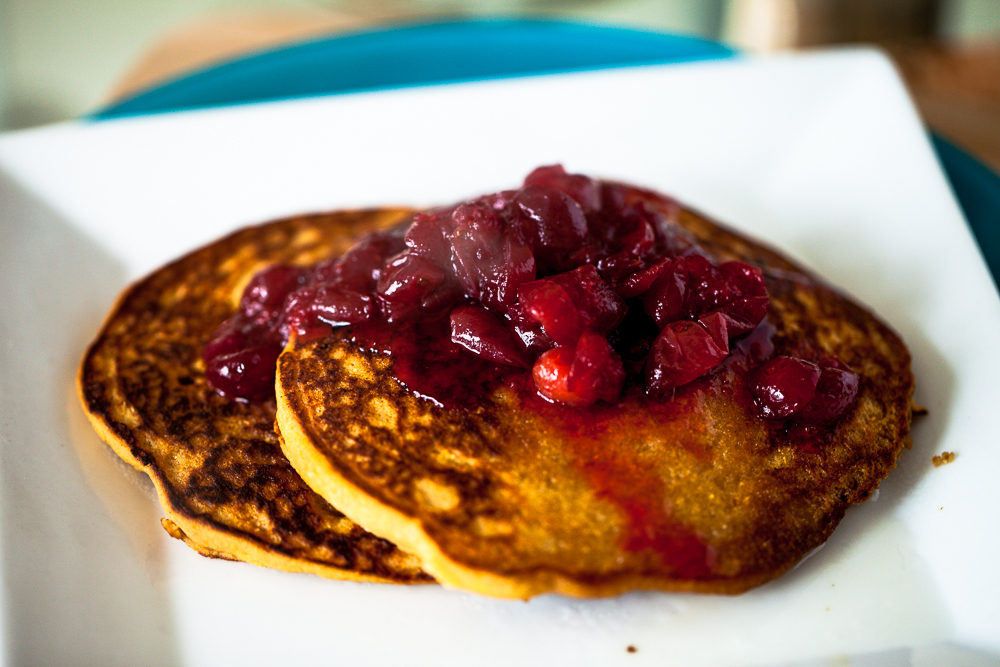 Persimmon Cornmeal Pancakes with Maple Cranberry Sauce