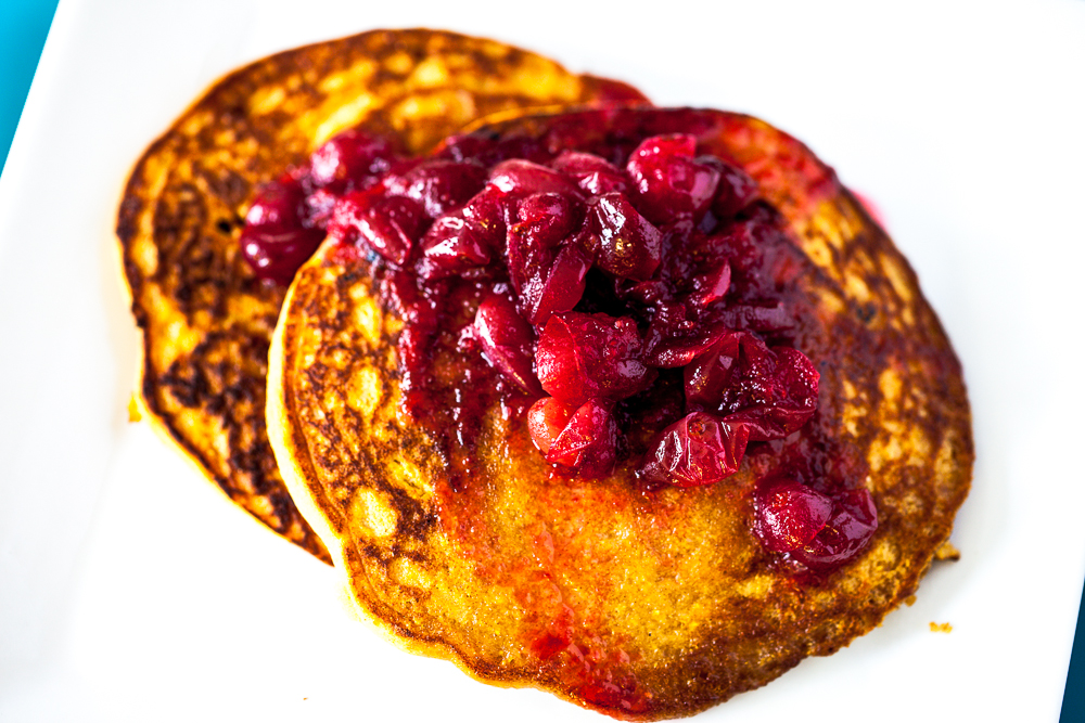 Persimmon Cornmeal Pancakes with Maple Cranberry Sauce 