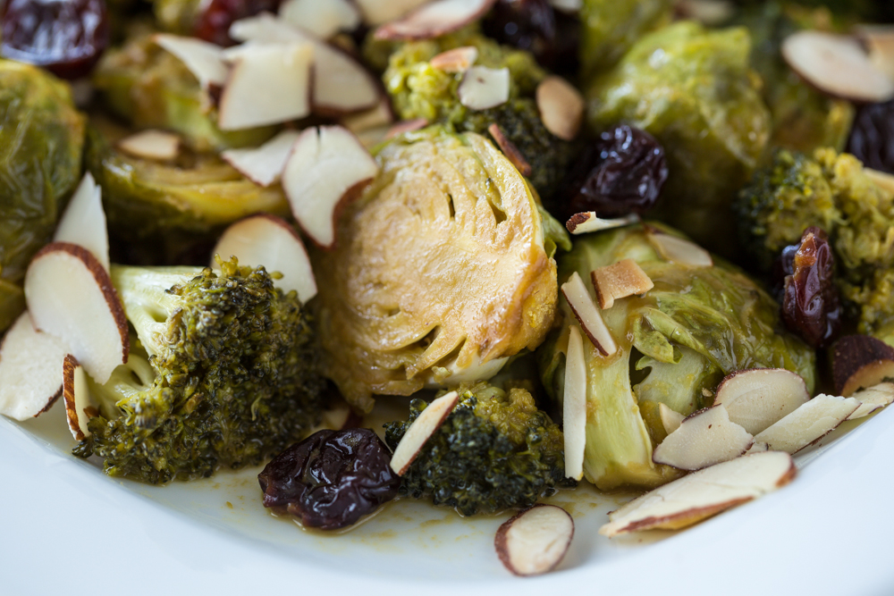 Cheesy Maple Roasted Brussels Sprouts & Broccoli with Dried Cherries & Almonds